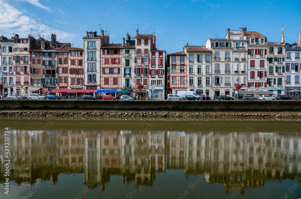 Traditional facades with colorful windows in Bayonne, Basque Country, France