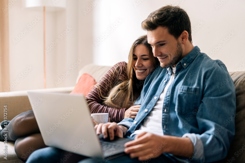 Happy Couple Using Laptop Happy Couple Using Laptop