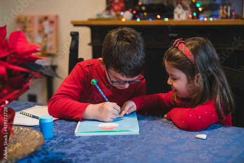 Siblings Writing to Santa Claus for Christmas photo