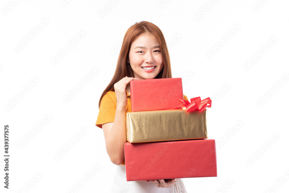 Attractive Asian woman holding gift box in christmas, new year, valentine day, birthday celebration concept. Portrait of smiling happy pretty girl hold gift box isolated on white with copy space. Attractive Asian woman holding gift box in christmas, new year, valentine day, birthday celebration concept. Portrait of smiling happy pretty girl hold gift box isolated on white with copy space.
