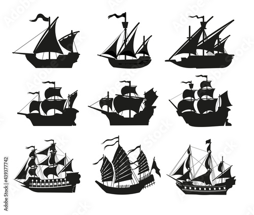 Leinwand Poster Pirate boats and Old different Wooden Ships with Fluttering Flags