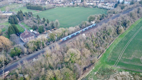 Train intersect English countryside.
