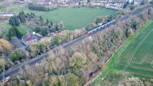 Train intersect English countryside.