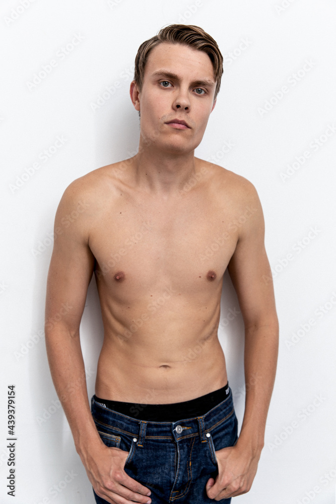 Portrait of handsome young and sexy man guy topless naked torso metrosexual hot tender body wear jeans isolated white background. Portrait of handsome young and sexy man guy topless naked torso metrosexual hot tender body wear jeans isolated white background.