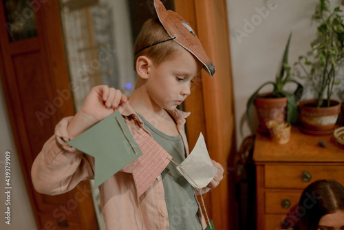 portrait of a little boy wearing a wolf mask photo