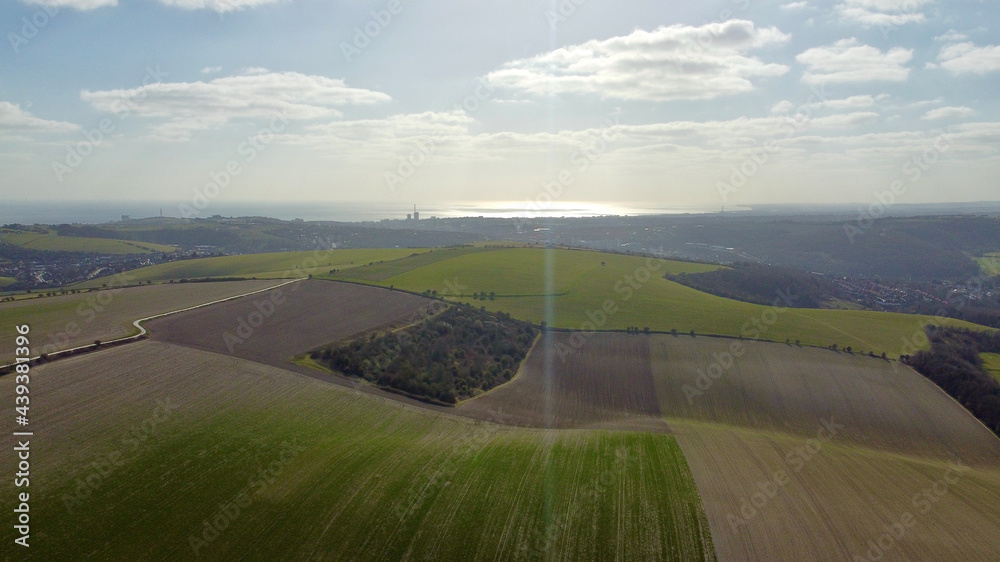 Aerial view of countryside and sea.