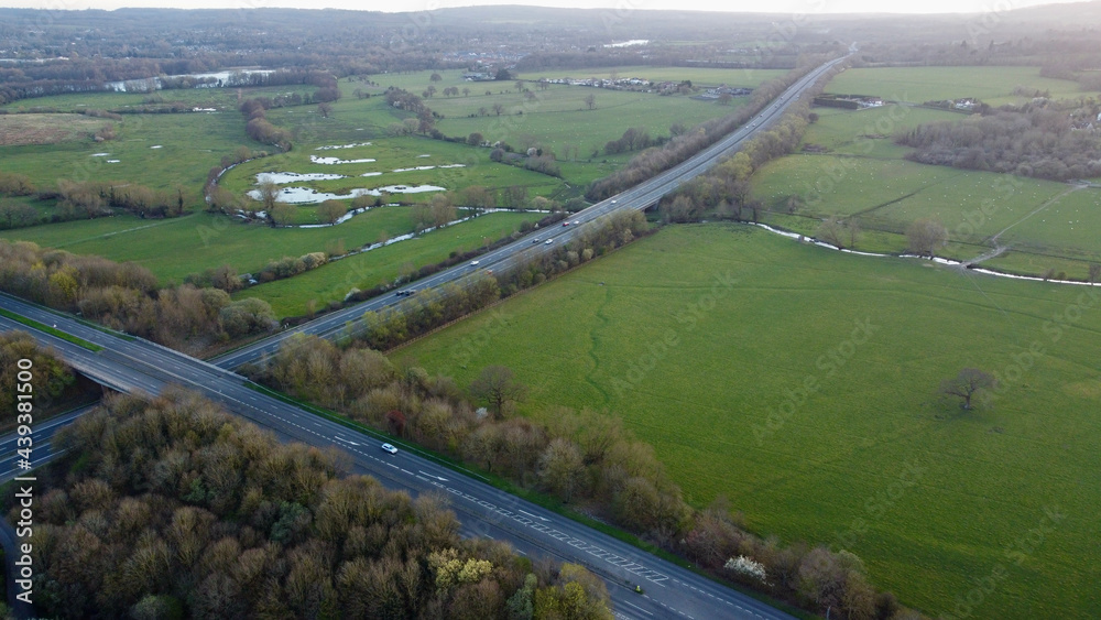 Motorway intersecting English countryside.