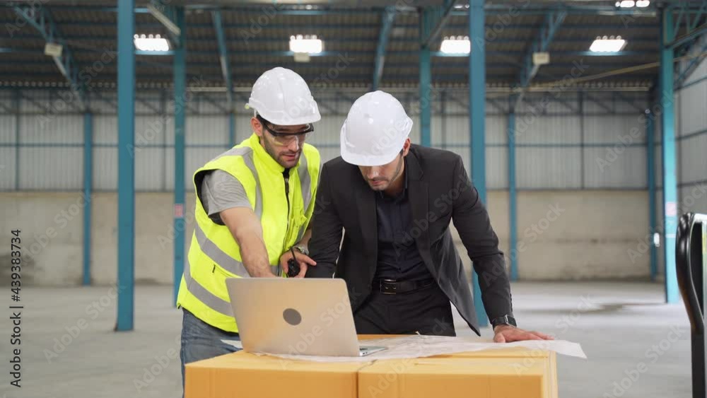 Factory engineer brainstorming on warehouse work problems.
Factory engineer brainstorming on warehouse work problems.