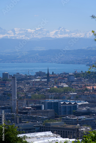 Fototapeta Naklejka Na Ścianę i Meble -  Panorama view over the City of Zurich with lake Zurich and Swiss alps in the background at a beautiful summer day. Photo taken June 14th, 2021, Zurich, Switzerland.