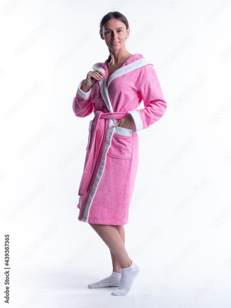 woman in a Bathrobe on an isolated white background with a smile on her face. woman in a Bathrobe on an isolated white background with a smile on her face.