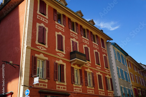 colorful facade of buildings downtown Barcelonnette, France