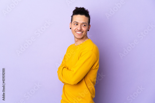 Caucasian man over isolated background looking to the side and smiling