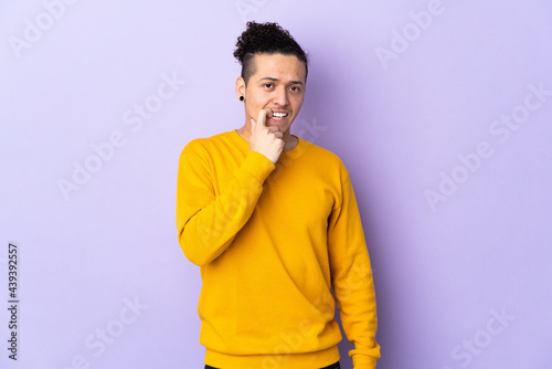 Caucasian man over isolated background nervous and scared