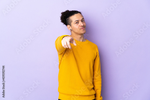 Caucasian man over isolated background pointing front with happy expression