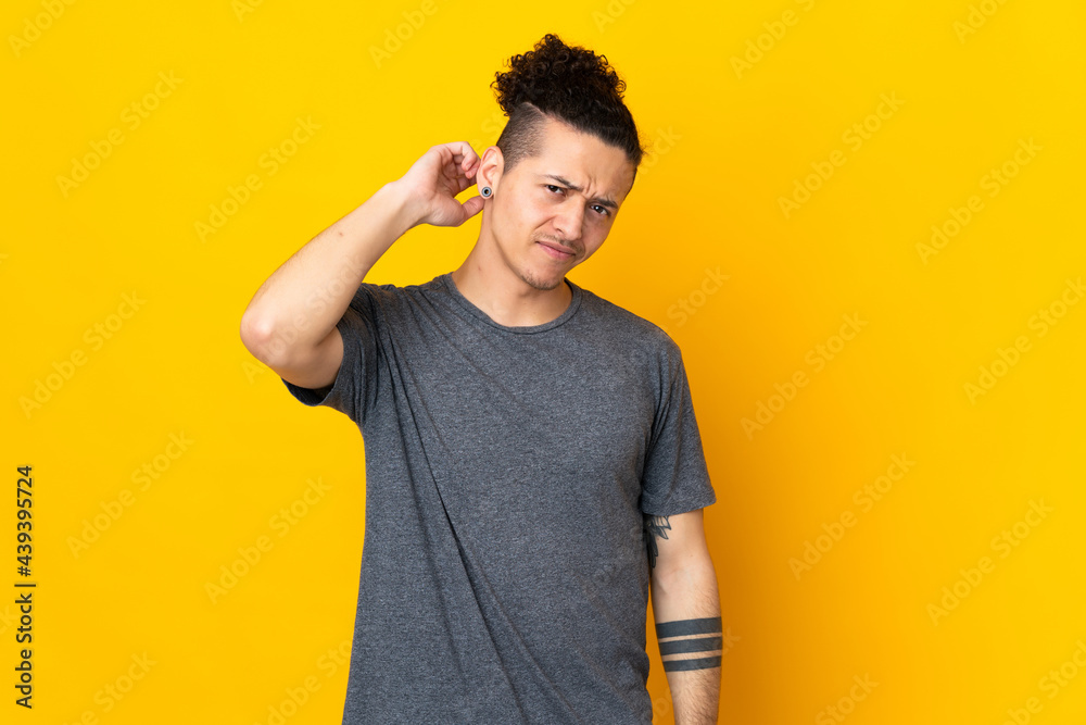 Caucasian man over isolated background having doubts Caucasian man over isolated background having doubts