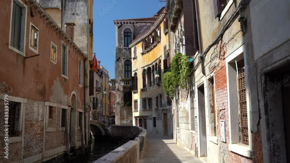 Venice, Italy - June 2021 - Walking through the less touristy streets of the lagoon city, among lesser-known canals, bridges and houses Venice, Italy - June 2021 - Walking through the less touristy streets of the lagoon city, among lesser-known canals, bridges and houses