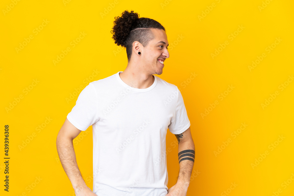 Caucasian man over isolated background looking to the side and smiling