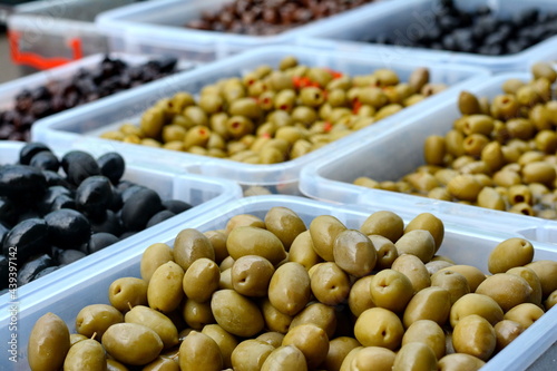 olives in the market. Background of olives close up. Healthy food background. Food concept.
