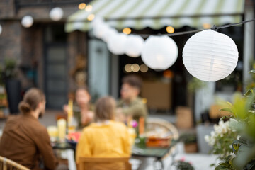 Blurred image for background of a festive dinner at backyard of a house