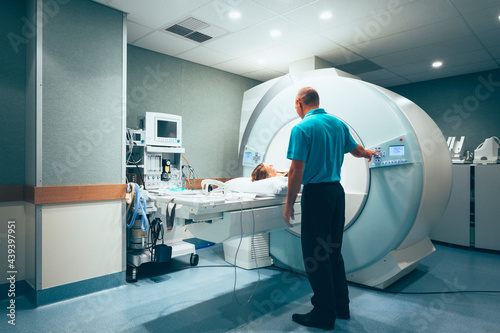 CT scanner with patient and radiologist  photo