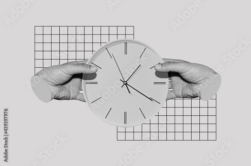 Male hands holding a clock photo