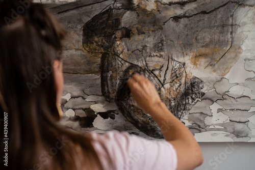 Woman drawing with charcoal photo