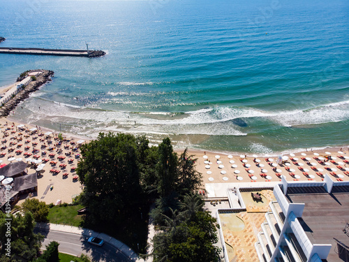 Aerial view of the beach and hotels near Varna and Golden Sands, Zlatni Piasaci. Popular summer resort near Varna, Bulgaria. Drone view from above. Summer holidays destination photo