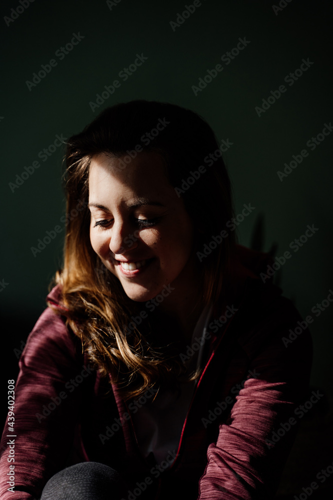 Portrait of woman looking down and smiling Portrait of woman looking down and smiling
