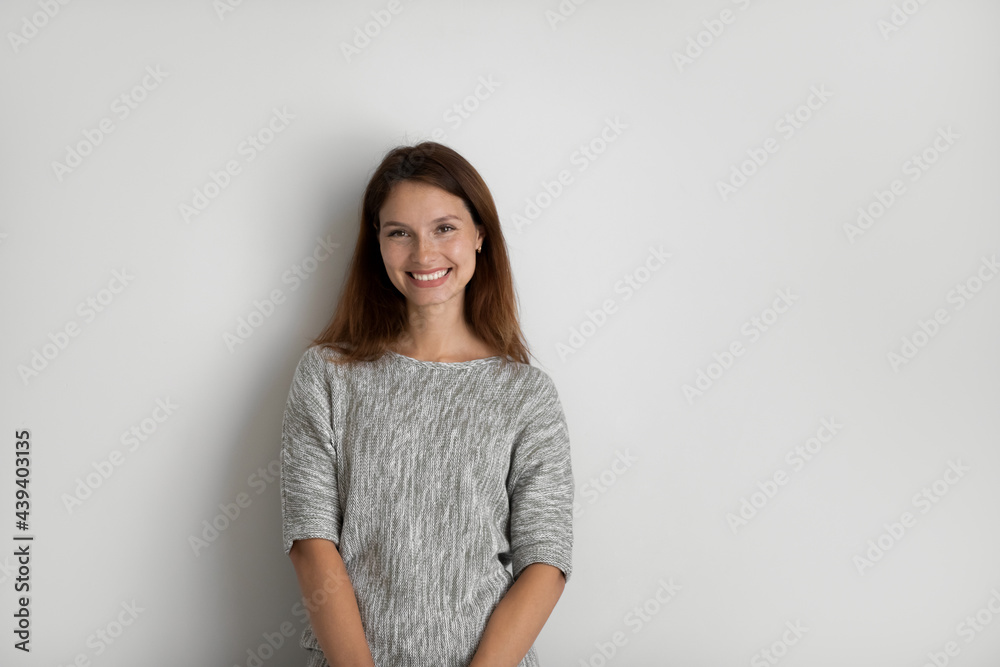 Portrait of happy beautiful woman on grey studio background isolated, excited young female with healthy toothy smile looking at camera, natural beauty, confident businesswoman posing for photo Portrait of happy beautiful woman on grey studio background isolated, excited young female with healthy toothy smile looking at camera, natural beauty, confident businesswoman posing for photo