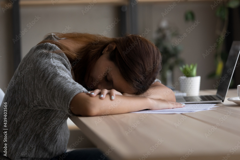 Woman Sleeping Under Desk