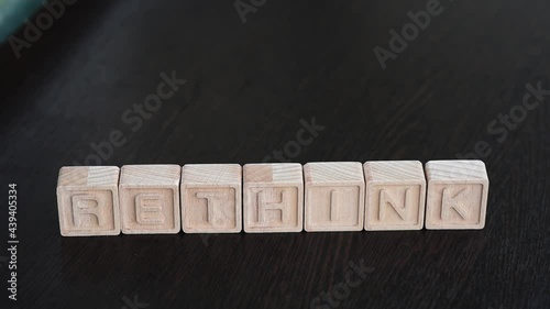 Female hands change first letter in word bethink so that it turns to rethink. Concept photo