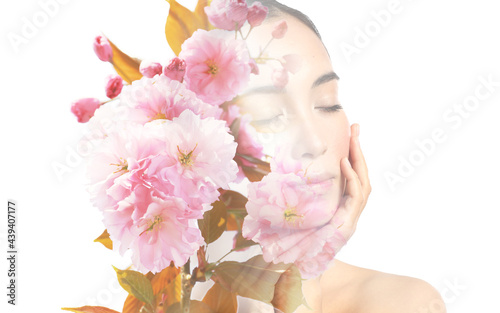 Fototapeta Naklejka Na Ścianę i Meble -  Creative portrait of young Asian woman with beautiful flowers on white background