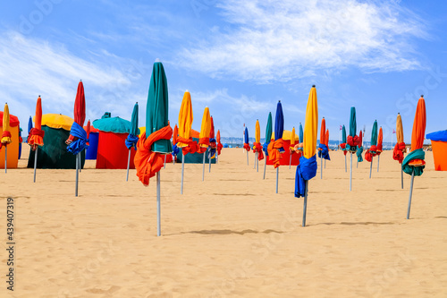 Fotografie Colourful parasols, landmark of Deauville Beach, famous resort in Normandy, Northern France