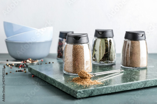 Fototapeta Naklejka Na Ścianę i Meble -  Jars with different spices on table