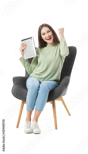 Happy young woman with tabl...