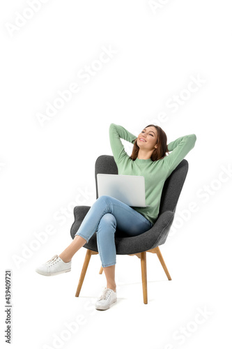 Young woman with laptop sit...