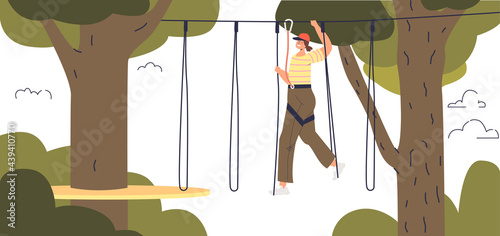 Girl enjoy activity in adventure rope park. Young female fun in extreme park outdoors climbing