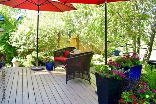 Фотография Private oasis small yard and garden for quiet morning coffee and tea, before starting work at home workday on beautiful summer morning