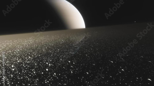 Saturn is a huge planet of the solar system with beautiful rings. Cinematic animation of rings made of stones, dust and ice photo