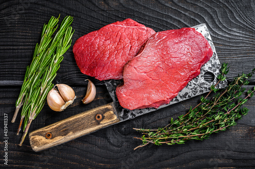 Fototapeta Raw marble beef meat fillet steak on butcher cleaver