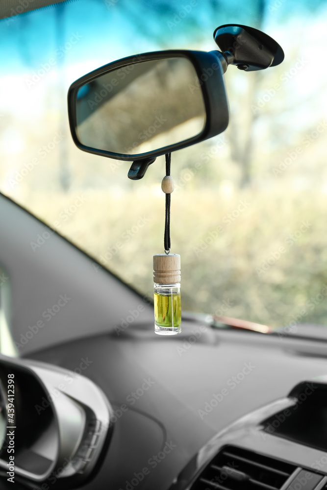 Air freshener hanging in car, closeup Air freshener hanging in car, closeup