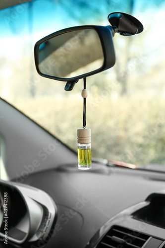 Air freshener hanging in car, closeup