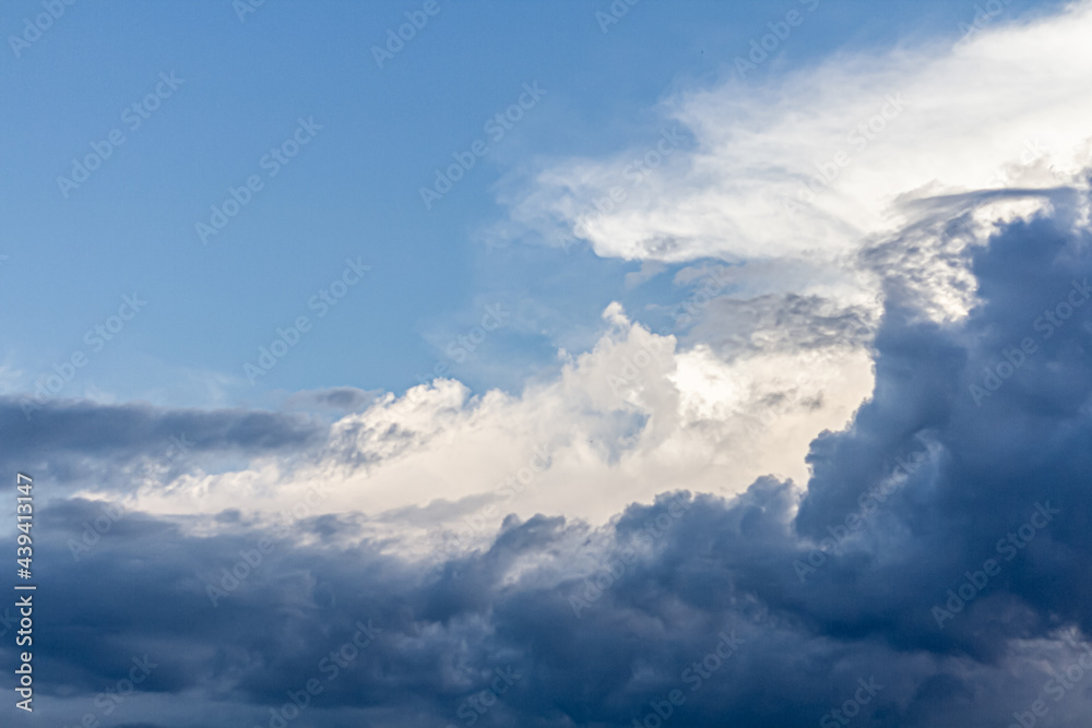 Gray blue sky and beautiful columnus clouds. View from below. It's going to rain soon. Gray blue sky and beautiful columnus clouds. View from below. It's going to rain soon.
