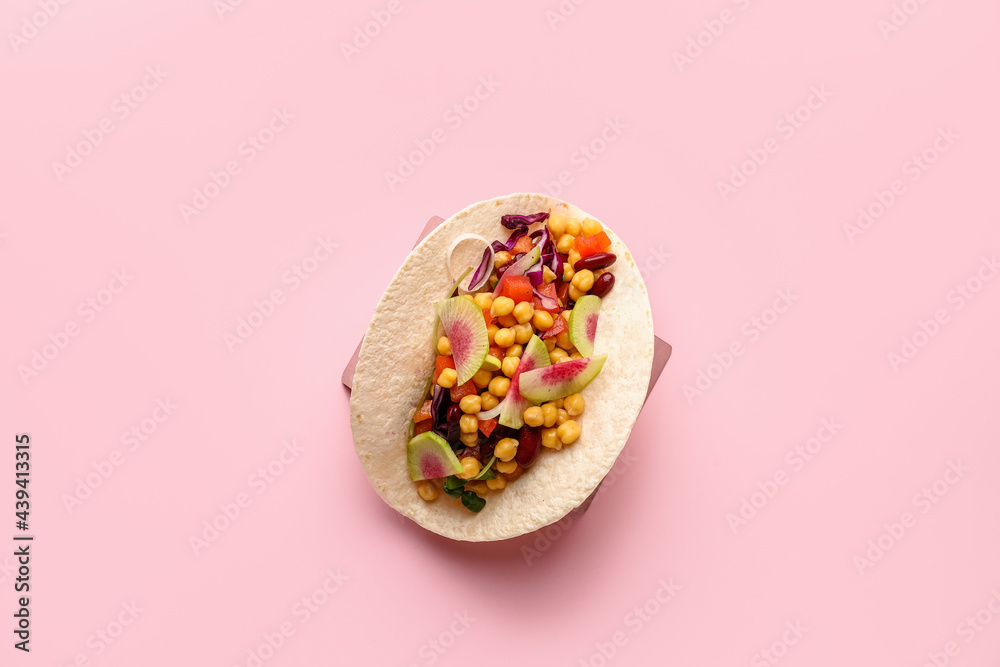Stand with tasty vegetarian taco on color background Stand with tasty vegetarian taco on color background