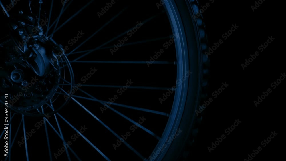 Bike Wheel Closeup With Flashing Car Lights At Night