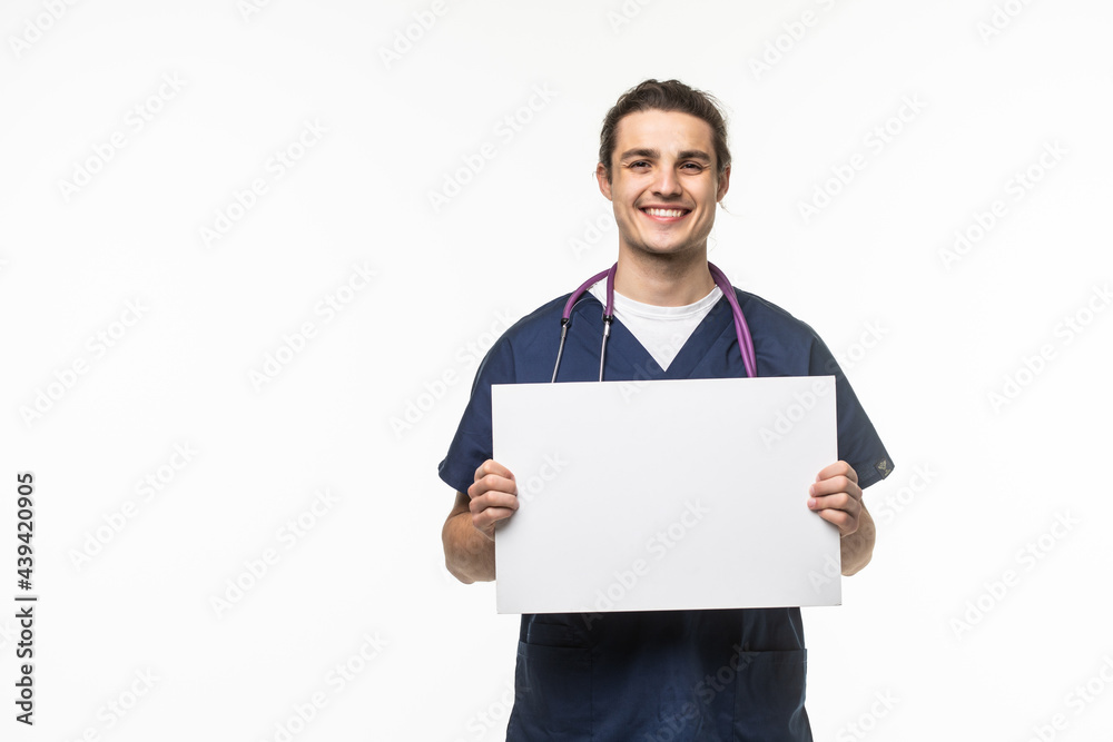 Smiling medical doctor presenting empty board isolated on white background Smiling medical doctor presenting empty board isolated on white background