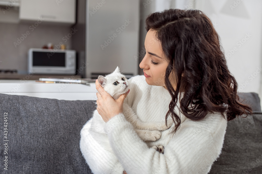 Pretty young woman playing with her cat Pretty young woman playing with her cat
