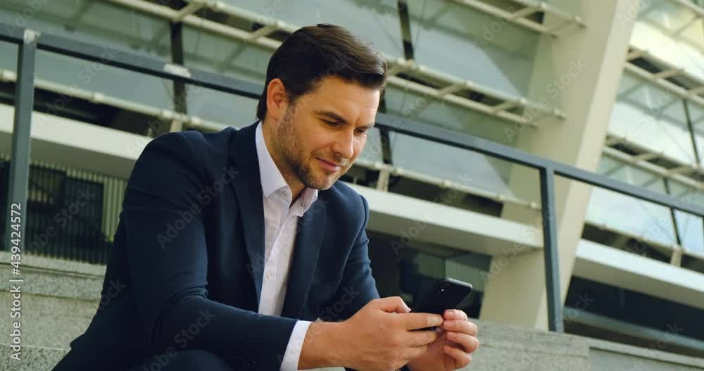 Attractive young businessman on the phone in an office building. businessman talking on phone,looking at screen,entrepreneur manager consulting client by call, discussing project, handsome businessman Attractive young businessman on the phone in an office building. businessman talking on phone,looking at screen,entrepreneur manager consulting client by call, discussing project, handsome businessman