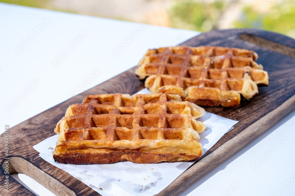 Belgian sugar waffles served on outdoor cafe terrace Belgian sugar waffles served on outdoor cafe terrace