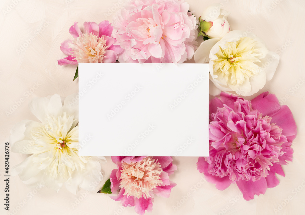 Obraz premium Beautiful blank wedding stationery card and fresh peonies